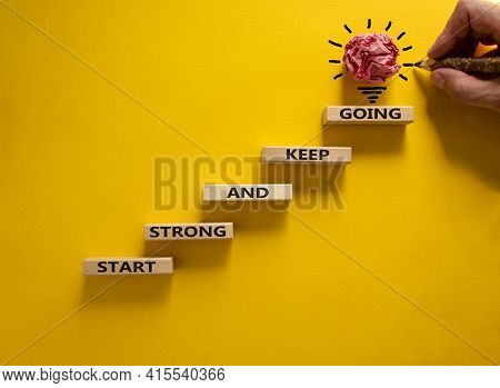 Start Strong And Keep Going Symbol. Concept Words 'start Strong And Keep Going' On Wooden Blocks On 