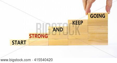 Start Strong And Keep Going Symbol. Concept Words 'start Strong And Keep Going' On Wooden Blocks On 