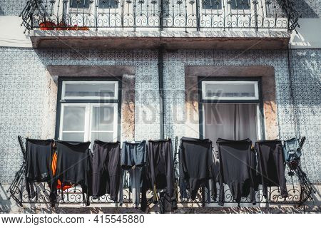 A Typical Portuguese Facade of A Residential House Tiled With Traditional Bluish Azulejo Pattern Til