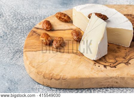 Brie Type Of Cheese. Camembert Cheese. Fresh Brie Cheese And A Slice On A Wooden Board With Sweet Al