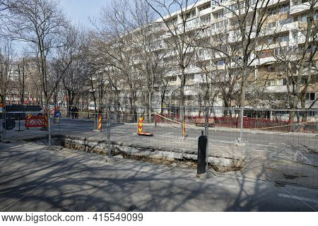 Bucharest, Romania - March 28, 2021: Big Hole In The Road For Workers To Repair A Radet Pipeline In 