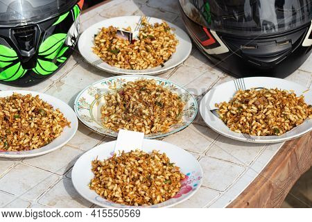 Spicy Parched Rice  Plates  In The Table