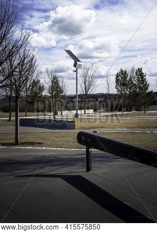 A Solar Powered Lamp Post Recharging In The Sun At A Public Community Skateboard Park In Airdrie Alb