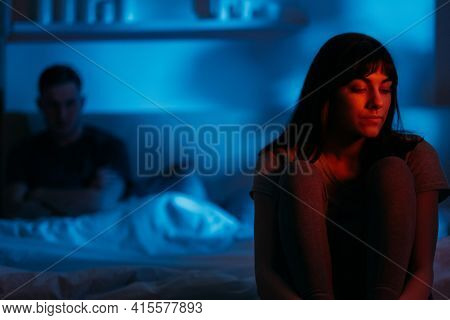 Couple Quarrel. Night Conflict. Marriage Crisis. Disappointed Upset Woman Overthinking Sitting On Be