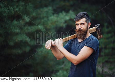 Gray-haired Stylish Brutal Bearded Man In A Dark Sleeveless T-shirt With A Large Mustache And Gray H