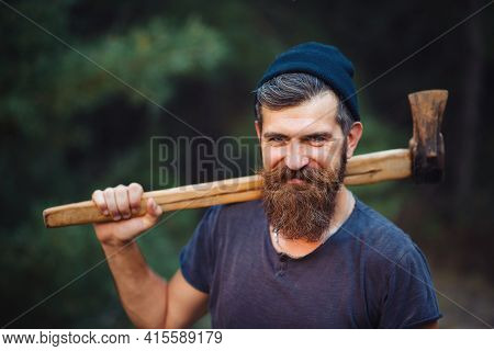Smiling Stylish Brutal Bearded Man In A Dark Sleeveless T-shirt With A Large Mustache And Gray Hair