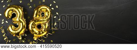 Golden Foil Balloon Number Thirty Eight. Birthday Or Anniversary Card With The Inscription 38. Black