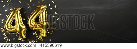 Golden Foil Balloon Number Forty Four. Birthday Or Anniversary Card With The Inscription 44. Black C