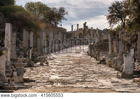 Historic marble slabs of the Curetes street in Ephesus Ancient City at sunny day in Selcuk, Turkey. Ancient and historical road from the roman period.