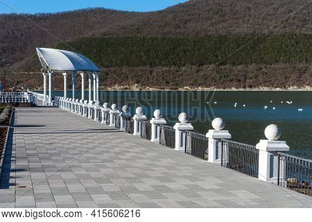 Beautiful View Of The Shore Of Lake Abrau In Early Spring. Picturesque View Of Embankment Of Lake Ab
