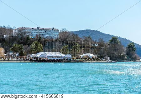 Beautiful View Of The Shore Of Lake Abrau In Early Spring. Picturesque View Of Embankment Of Lake Ab