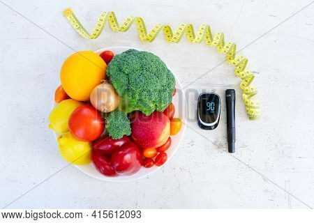 Plate Of Raw Vegetables With Blood Glucose Meter And Lancet, Diabetes Healthy Diet Concept