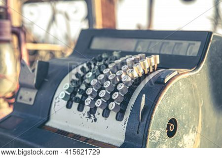 Close Up Of An Old Vintage Mechanical Cash Register On A Blurred Background.