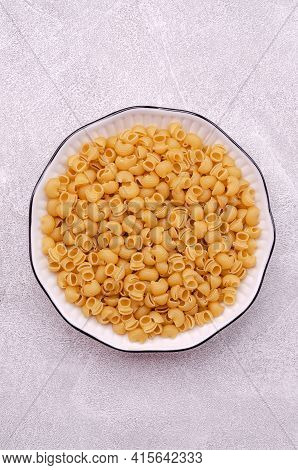 Traditional Dry Pasta On A Light Gray Background. Design Concept. A Copy Of The Space. Selective Foc