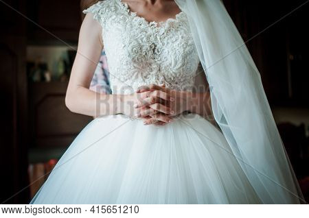 Bride In White Wedding Dress Holding Hand In Hand