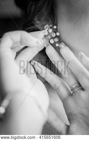Bride Wearing Earring On The Ear Black And White