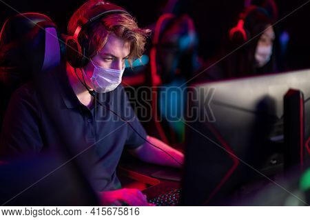 Hosting An Esports Tournament During A Pandemic And Quarantine. An Esports Player In A Medical Mask 
