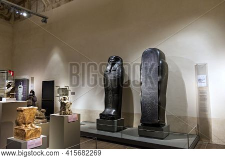 Egyptian Museum, Turin, Italy - February 2021: Stela Of An Egyptian Deity In Black Diorite, A Stone 