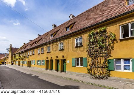 Augsburg, Germany - April 29, 2015: Sthe Fuggerei Is The Worlds Oldest Social Housing Complex Still 