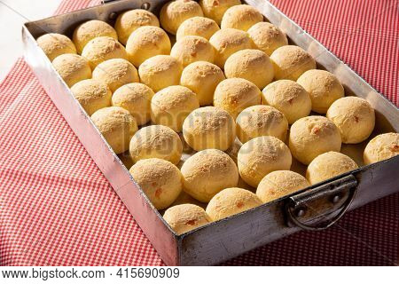 Cheese Bread, Shape Filled With Cheese Bread That Has Just Come Out Of The Oven On A Checkered Table