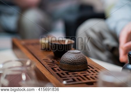 Special Yixing Clay Cups For Chinese Tea Are Prepared For The Ceremony On The Gongfu Bamboo Tray. Cl
