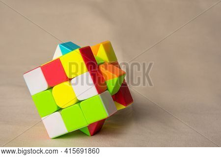 Araras, São Paulo, Brazil, April 4, 2021, Magic Cube On Beige Fabric, Selective Focus.