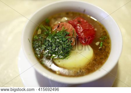 Bowl With Shurpa On Table In Restaurant