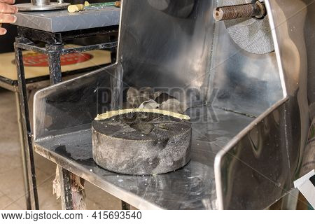 Mill Being Prepared To Take Out Dough. One Of The Stones Brings Muddy Mass On It