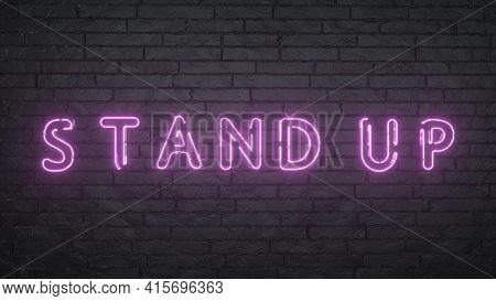 Stand Up Neon Sign. Glowing Stand Up Emblem On Black Brick Wall Background. 3d Rendering.