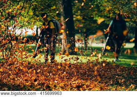 People Operating A Heavy Duty Leaf Blower.