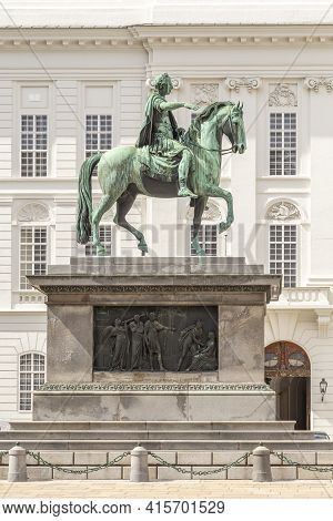 Vienna, Austria - April 24, 2015:  Statue Of Kaiser Joseph Ii (1741-1790) In The Josefplatz; The Bui