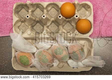 The Process Of Dyeing Eggs Into Onion Husks. Ecological Coloring Of Eggs For Easter. Drawing From Pa