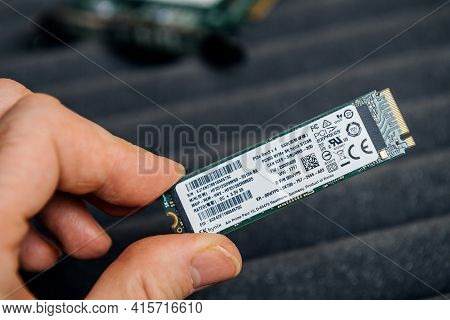 Paris, France - Dec 20, 2020: Pov Male Hand Holding New Sk Hynix Nvme Fast M2 Disk Drive - Disk Repl