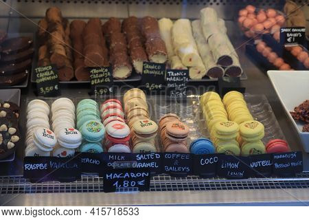 Barcelona, Spain - September 29th 2019: Macarons And Chocolats In A Shop. Macarons With Souvenir Pri
