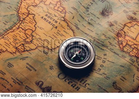 Old Compass Discovery On Vintage Paper Antique World Map Background, Retro Style Cartography Travel 