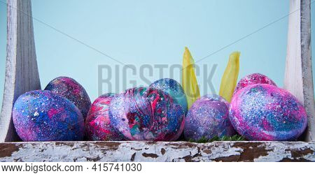 Colorful Painted Eggs With Bright Shiny Gliter In Wooden Basket
