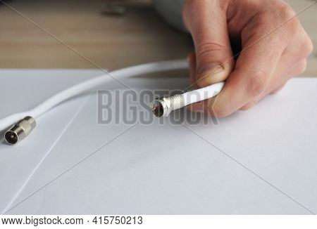 Replacing And Repairing A Coaxial Cable, Tv Cable Connector. A Man Is Fixing A Broken Coaxial Tv Cab