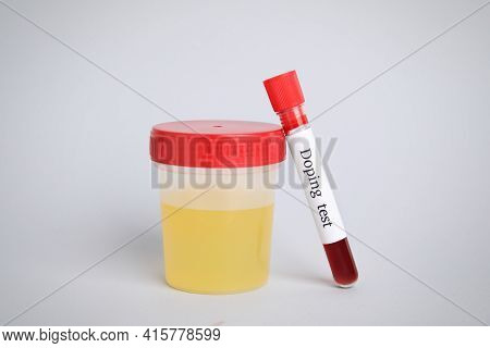 Jar And Test Tube With Samples On Light Grey Background. Doping Control