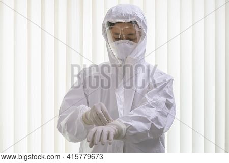 Male Nurse Or Doctor Wearing Ppe Suit And Facemask Perform Coronavirus Covid-19 Pcr Test. Doctor Put