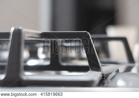 Silver Pan On A Modern Silver Gas Stove In The Kitchen Close-up.