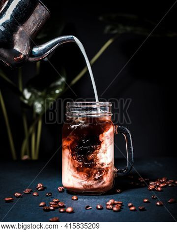 Beautiful Close Up Photo Of A Coffee And Milk Mixed Drink
