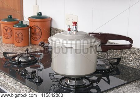 Pressure Cooker; Photo About Stove In The Kitchen.