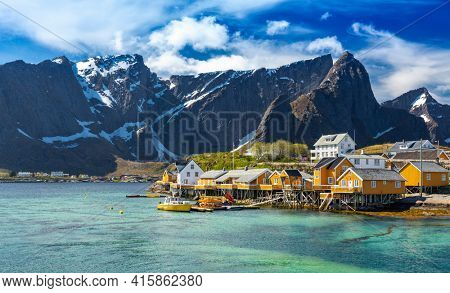 Yellow Fishing hut (rorbu) in the Hamnoy Islands - Sakrisoy (Sakrisoya) Reine, Hamnoy, Moskenes, Lofoten islands, Norway