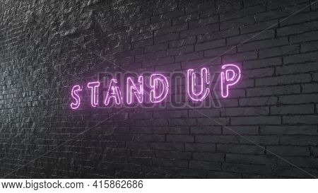Glowing Stand Up Emblem On Black Brick Wall Background. 3d Illustration.