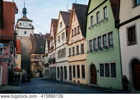 Medieval Narrow Street, Colorful Renaissance And Gothic Historical Buildings, White Tower Or Weisser