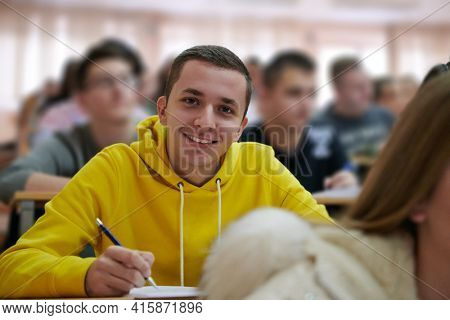 student taking notes while studying in high school
