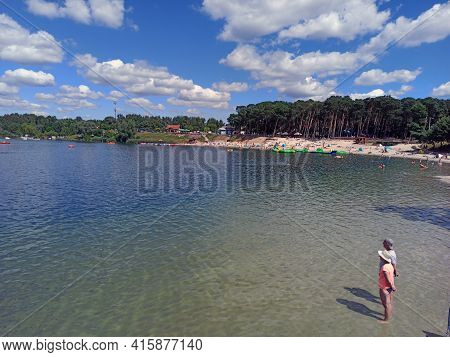 Krakow, Poland - May 05, 2021: Couple Of People Standing On A Kryspinow Man Made Lake Lagoon Water I