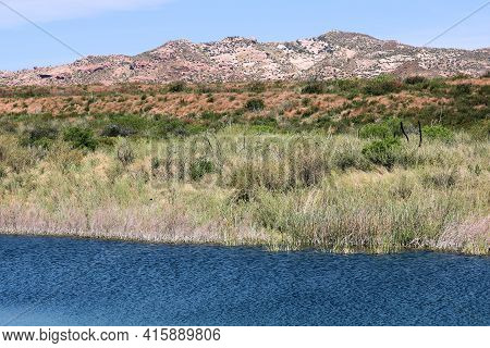 Sag Pond Caused From The San Andreas Fault Surrounded By Chaparral Plants And Arid Badlands Beyond T