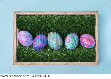 Colorful Painted Eggs With Bright Shiny Gliter In Wooden Box