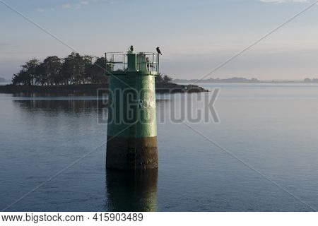 Lighthouse With Bird Taken From The Island Of Arz In Brittany (morbihan), France.